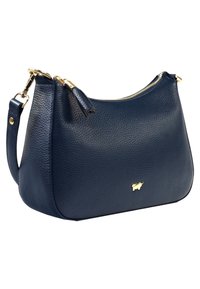 Borsa a tracolla in pelle blu navy con texture a granuli, dettagli in metallo dorato e chiusura a zip. Dotata di una sola tracolla per il trasporto.