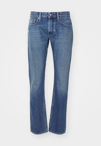 Blå jeans i denim med rak benform, utrustade med blixtlås och fem fickor. Blekt tvättad med lätt slitning på låret.