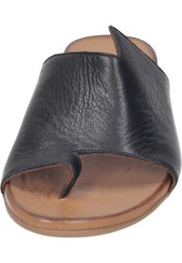 Black leather slide sandal featuring an open toe, curved upper design, and smooth tan insole. The sole is flat with a slight, rounded shape.