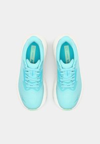 Light blue running shoes with a mesh upper, padded tongue, and white sole. Features lace-up closure and textured accents. Model ARAHI 7.