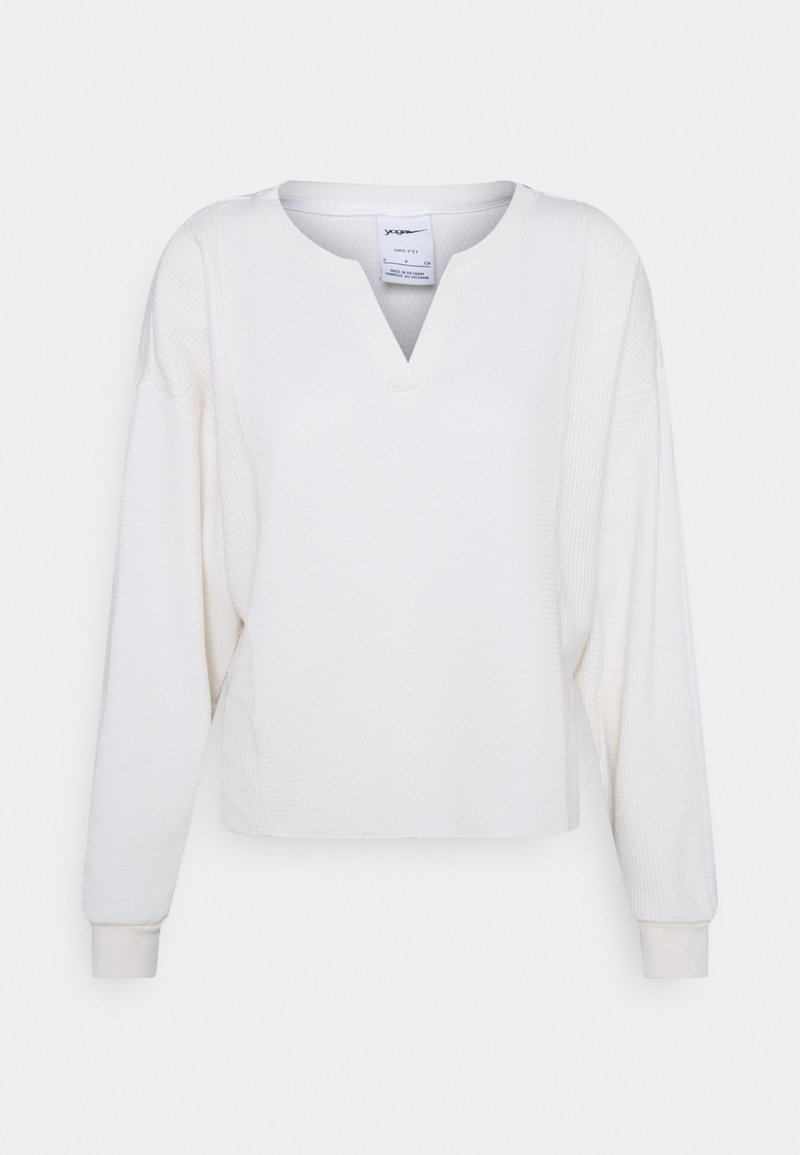 Witte longsleeve pullover met een textuurpatroon, V-hals en geribde manchetten. Glad stof met een ontspannen pasvorm en iets kortere lengte.