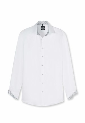 Witte blouse met lange mouwen en knopen, met een patroon aan de binnenkant van de kraag en manchetten, kraag open.