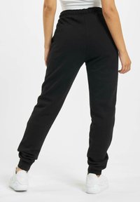 DEF LOLA - Verryttelyhousut - black