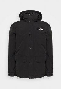 Veste d'hiver noire imperméable avec capuche, boutons-pression à l'avant, deux poches à rabat inférieures et logo The North Face sur la poitrine.