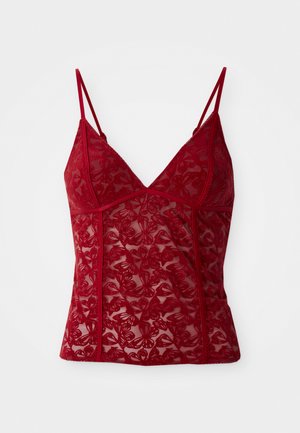 Red lace camisole with decorative butterfly pattern, adjustable straps, and a V-neckline. Sheer fabric with detailed stitching accents.