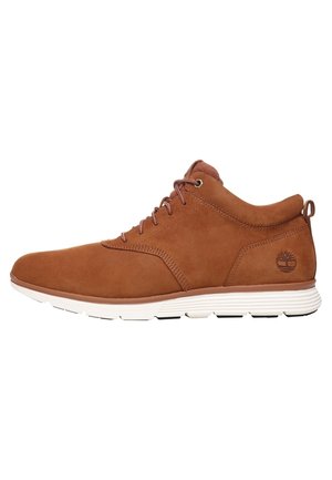 Brown leather lace-up ankle boot with white sole, padded collar, and Timberland logo on side.