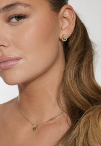 Guess Boucles d'oreilles - goldenfarbe