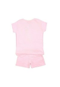 Ensemble en coton rose comprenant un haut à manches courtes et un short. Design simple avec une texture uni et une couleur pastel.