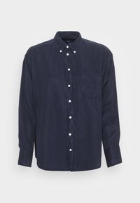 Navyblaues Hemd mit Knöpfen aus glattem Stoff, ausgestattet mit einem klassischen Kragen, langen Ärmeln und einer einzelnen Brusttasche.