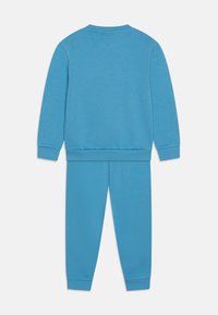 adidas Originals CREW SET - Calças de fato de treino - light blue