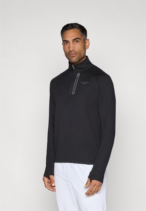 Svart långärmad zip-up-tröja med hög krage och delvis dragkedja. Slät tyg med en subtil logotyp i mörkgrått.