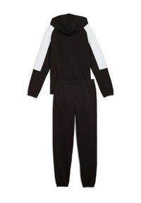 Tuta nera con cappuccio caratterizzata da dettagli bianchi sulle maniche, realizzata in tessuto morbido e elasticizzato. Include pantaloni della tuta abbinati con polsini elastici.