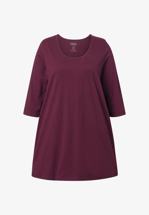 Burgundzka tunika z miękkiej bawełny, z okrągłym dekoltem i rękawami 3/4. Luźny krój, prosty dół i minimalne detale.