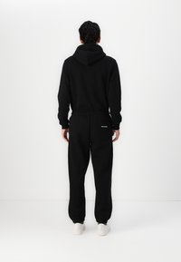 KARL LAGERFELD PANTS - Donji dijelovi trenirke - black