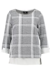 Haut à manches longues à carreaux gris avec des accents blancs aux poignets et un ourlet contrastant. Confectionné dans un tissu doux et texturé, il présente un col rond.