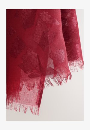 Transparenter roter Schal mit einem strukturierten Muster aus verschiedenen Formen und ausgefransten Rändern, der ein zartes und luftiges Erscheinungsbild erzeugt.