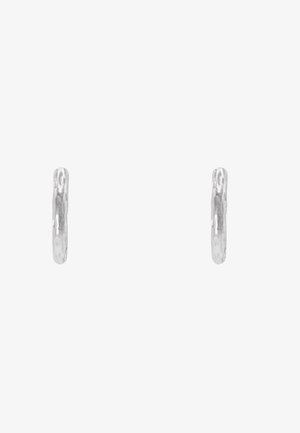 Silver hoop earrings with a hammered texture, featuring a seamless round shape. Smooth finish with a reflective surface.