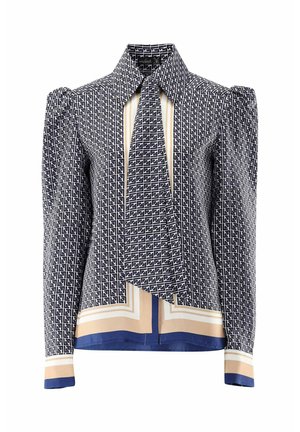 Langärmlige Bluse in Marineblau und Creme mit geometrischem Muster, ausgestattet mit einem Kragen, Bindedetails und kontrastierenden Abschlüssen an den Manschetten und dem Saum.