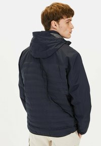 Navy insulated jacket with a hood, featuring a quilted texture, zippered front, and adjustable cuffs for a snug fit.