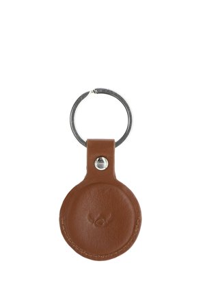 Brown leather keychain holder with circular shape and silver metal ring attached, featuring subtle embossed logo on front.