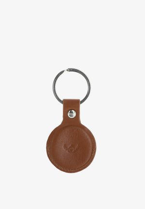 Porte-clés en cuir marron de forme circulaire avec un anneau en métal argenté attaché, doté d'un logo subtilement embossé sur le devant.