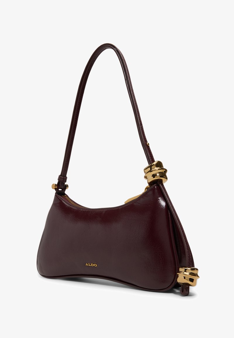 Dark burgundy leather shoulder bag with gold metal accents, a zipper closure, and a slim, curved strap.