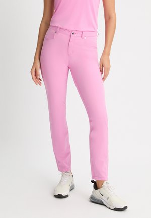Rosa avslappnade byxor i stretchigt material, med slim fit, fem fickor och dragkedja med knappstängning.