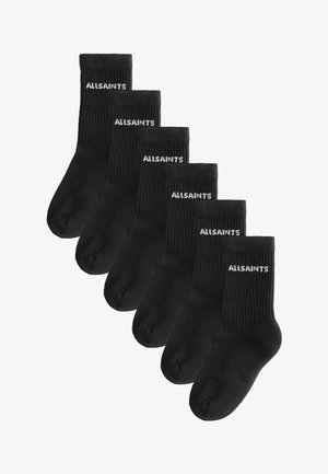 Juodos suknelės kojinės su baltu „ALLSAINTS“ logotipu. Šešios poros, kiekvienoje kojinėje yra manžetė ir lygi pirštinės siūlė patogumui.