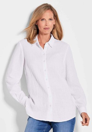 Witte button-up overhemd van geweven stof, met een klassieke kraag en lange mouwen. Lichtblauwe knopen en een afgeronde zoom.