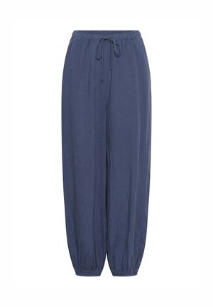 Pantalon ample bleu marine avec ceinture élastique et cordon de serrage, jambes fuselées avec poignets élastiques.
