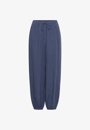 Pantalon ample bleu marine avec ceinture élastique et cordon de serrage, jambes fuselées avec poignets élastiques.
