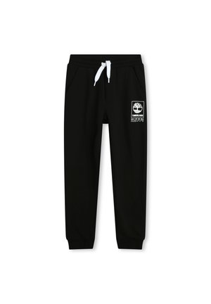 Pantalons de jogging noirs avec cordon blanc, poches latérales, chevilles resserrées et logo Timberland blanc sur la cuisse gauche.