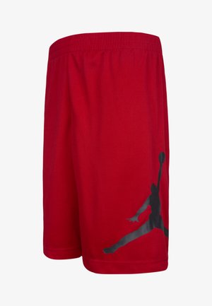 Røde idrettsshorts laget av pustende materiale, med et elastisk midjebånd og en stor svart Jumpman-logo trykket på siden.