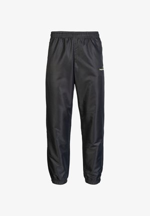 Pantaloni da corsa neri realizzati in materiale liscio e leggero. Vita elastica con polsini arricciati. Presenta un piccolo logo sulla parte inferiore della gamba.