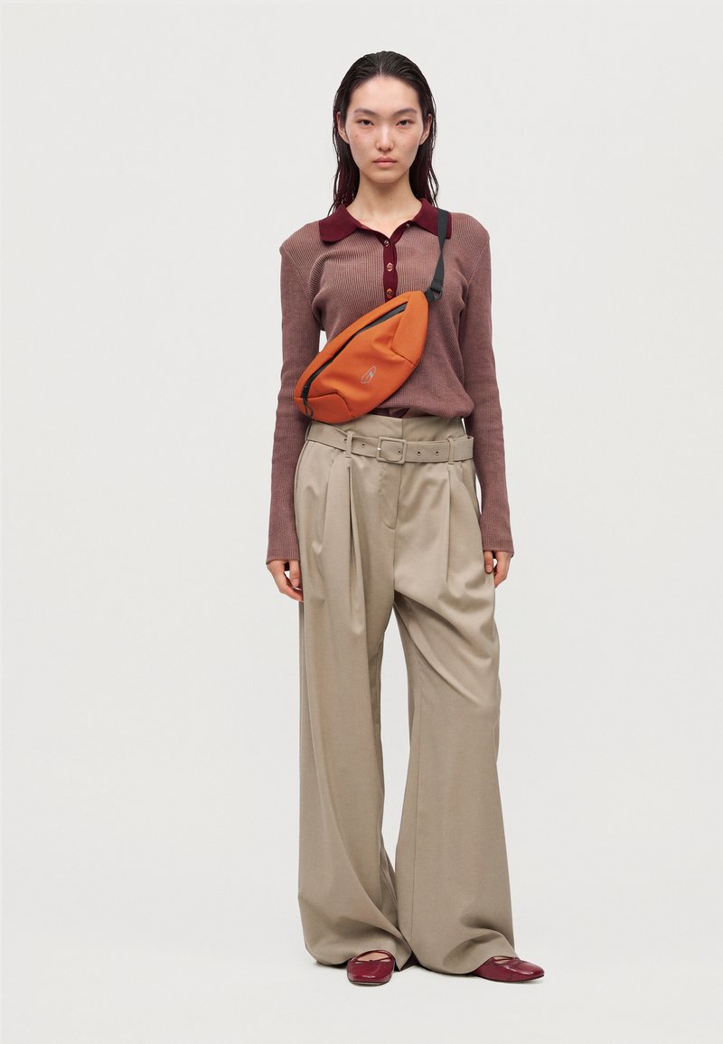 ARKK Copenhagen BUMBAG UNISEX - Bum bag - orange - Zalando.ie