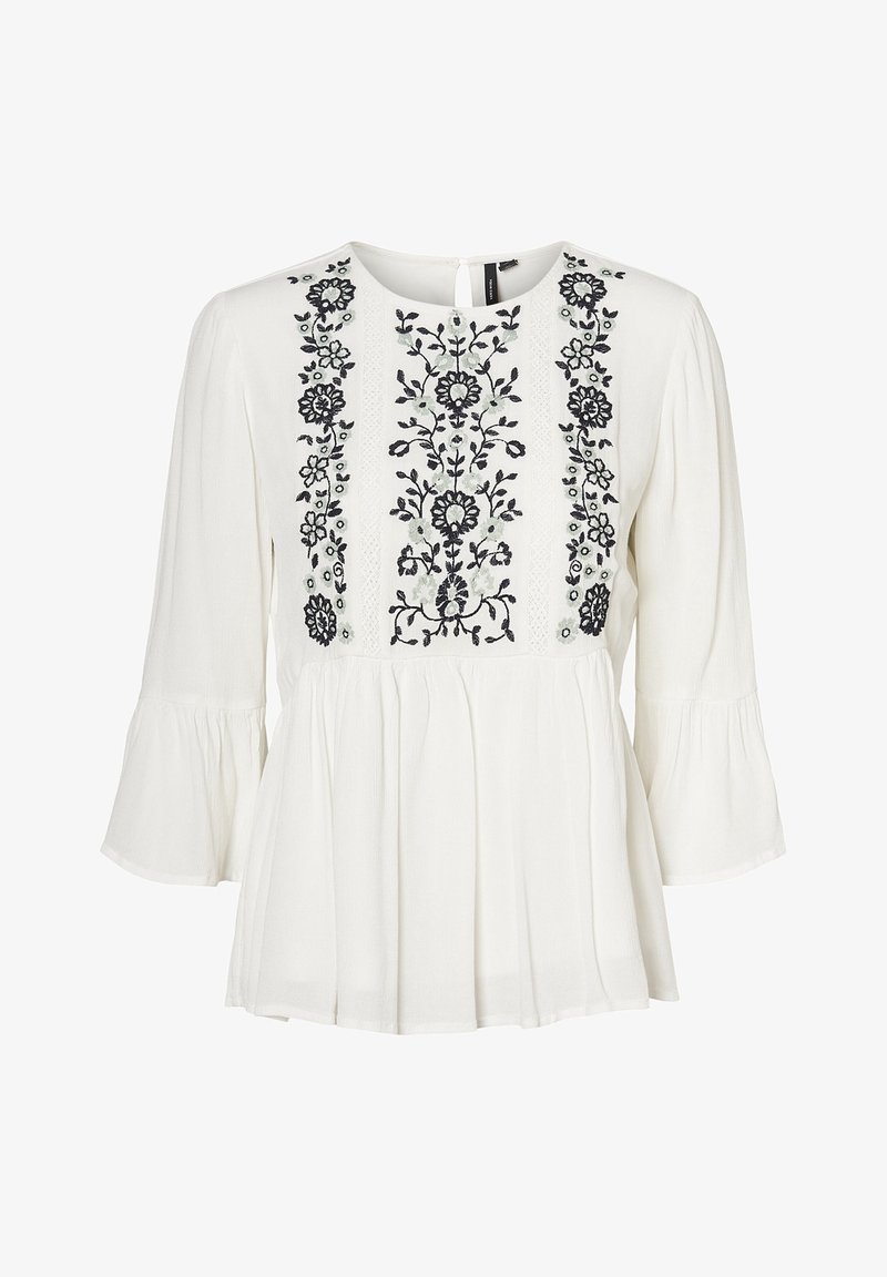 Weiße Bluse mit schwarzem Blumenstickerei auf der Vorderseite. Verfügt über einen runden Ausschnitt, lange Ärmel und einen gefältelten Saum. Weicher Griff.
