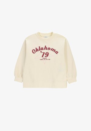 Bluza w kolorze kremowym z bordowym napisem "Oklahoma '79" oraz mniejszym tekstem "Cowgirl Always on the Run" na tle delikatnego różowego konturu gwiazdy.