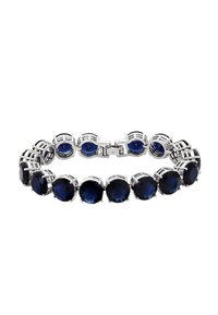 Bracciale in argento con grandi gemme tondo blu intenso collegate in un cerchio continuo, dotato di chiusura a moschettone.