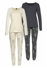 Two sets of loungewear: a cream long-sleeve top with three buttons paired with cream pants featuring a floral pattern; a dark gray top and black pants with similar floral designs.