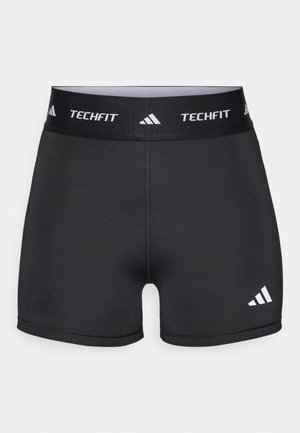 Sorte atletiske shorts med en bred talje, mærket "TECHFIT." Har en glat tekstur og et hvidt logo på nederste venstre side.
