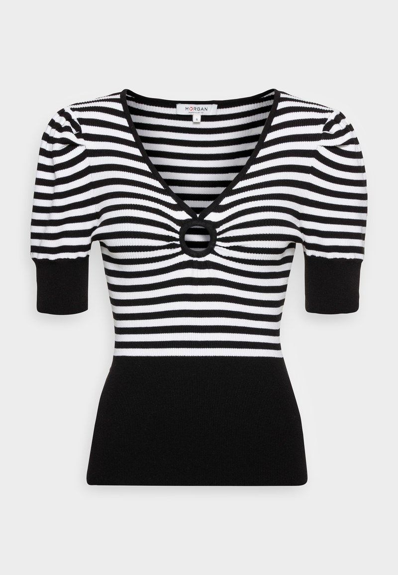 Haut en tricot à rayures noires et blanches avec manches courtes bouffantes, col en V profond et accent circulaire au niveau de la poitrine. Silhouette ajustée avec un bas uni noir.