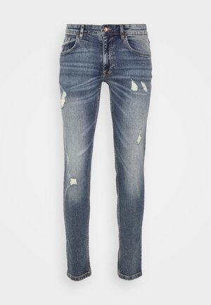 Denim jeans in een vervaagde blauwe was, met versleten patches en een slim fit. Klassiek vijf-pocket ontwerp met een rechte pasvorm.