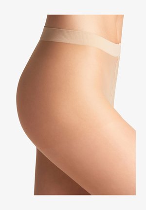Collants beiges transparents avec une ceinture douce, une texture lisse et un design sans coutures s'étendant jusqu'à mi-cuisse.