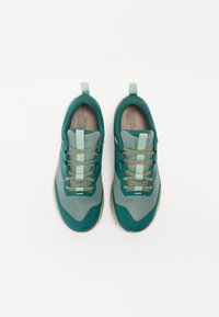 Teal and gray athletic shoes with breathable mesh upper, round toe, and textured rubber sole. Features laces and a pull tab at the heel.