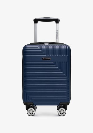 Blauer Hartschalenkoffer mit strukturierten Linien, vier drehbaren Rollen, ausziehbarem Griff und "WITTCHEN"-Logo vorne und am Griff.