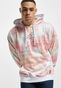 Hooded sweatshirt made of soft fabric, featuring a pink and pastel geometric pattern, with a kangaroo pocket and drawstring hood.