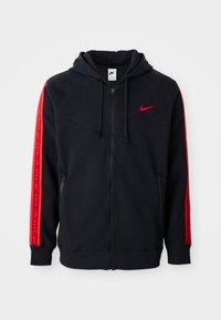Sweatshirt Nike preto com fecho e detalhes em vermelho nas mangas, bolsos tipo canguru e um logo bordado em vermelho no peito.