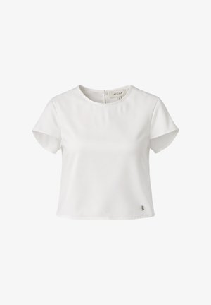Blusa bianca a maniche corte con scollo rotondo, piccolo logo in metallo vicino all'orlo e chiusura con cerniera posteriore, etichetta del marchio visibile all'interno del colletto.