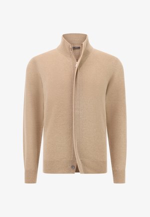 Vaalean beige vetoketjulla varustettu neuletakki, jossa on korkea kaulus, ribatty hihansuu ja helma, esillä valkoisella taustalla.