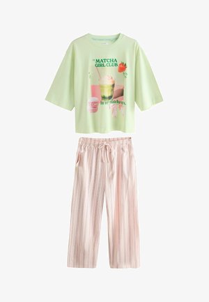 Light green short-sleeve top with "Matcha Girl Club" graphic, paired with loose, light pink striped drawstring pants.